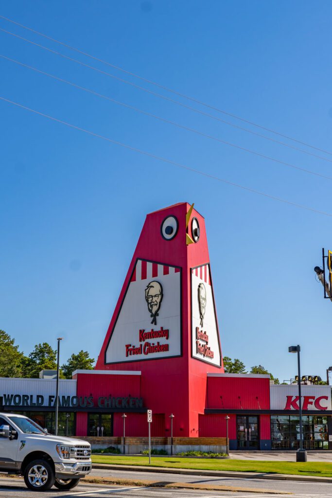 Close view of Marietta’s Big Chicken landmark, showing its oversized eye, yellow beak, and KFC signs