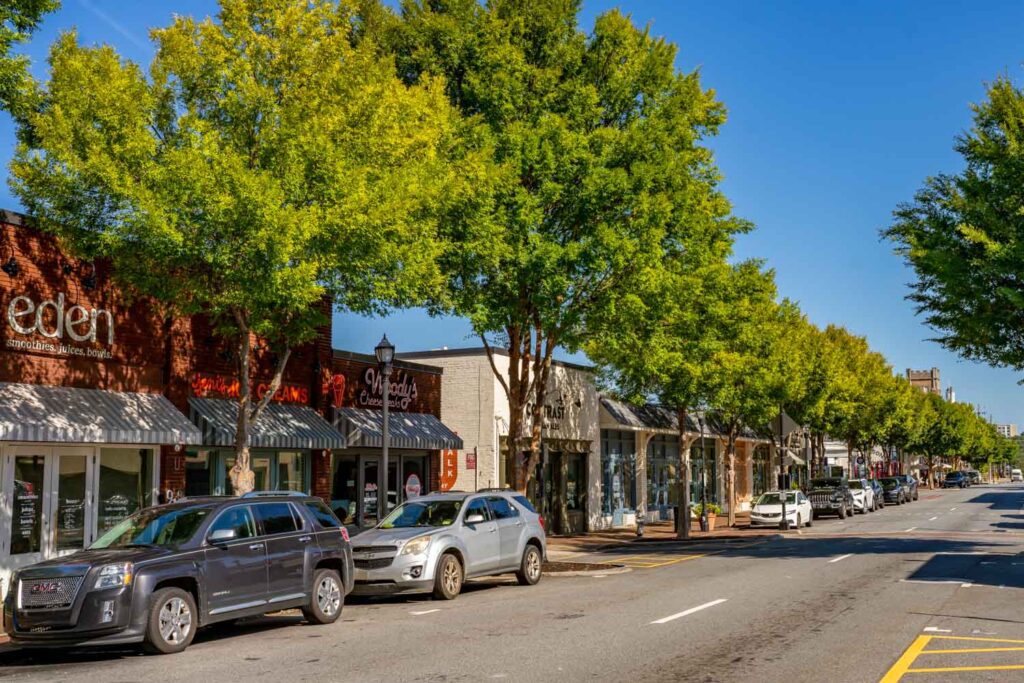 Tree-lined storefronts around Marietta Square, including ice cream, cheesecake, and coffee shops.